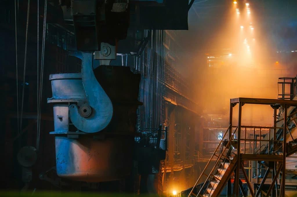 Glowing furnace inside a steel mill