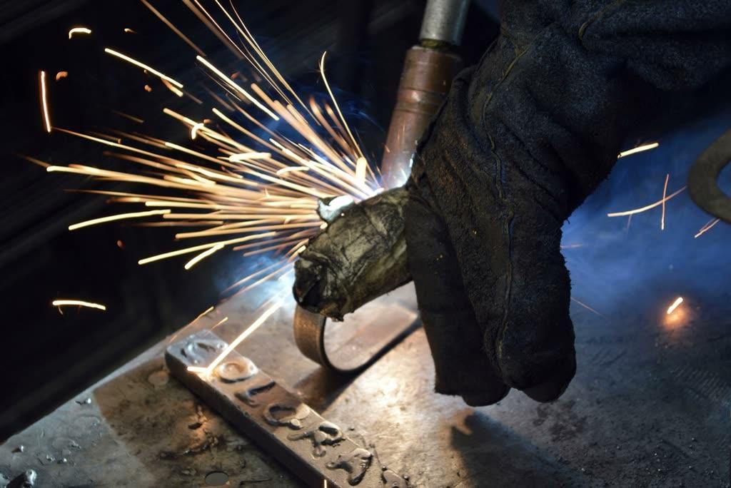 Sparks flying from a welder at work