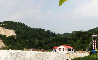 A wollastonite mine site set into a green hillside